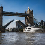 Yacht going under tower bridge